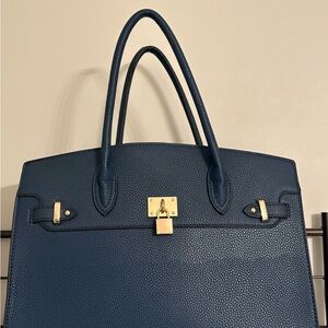 Elegant Blue Handbag with Gold Accents